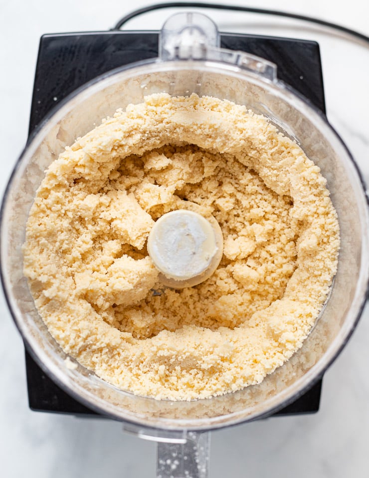 crumbly vegan shortbread dough in a food processor