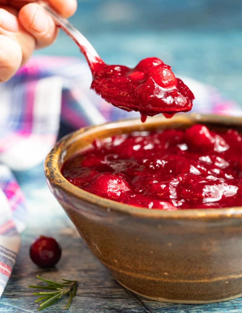 a spoon full of jammy Instant Pot Cranberry Sauce