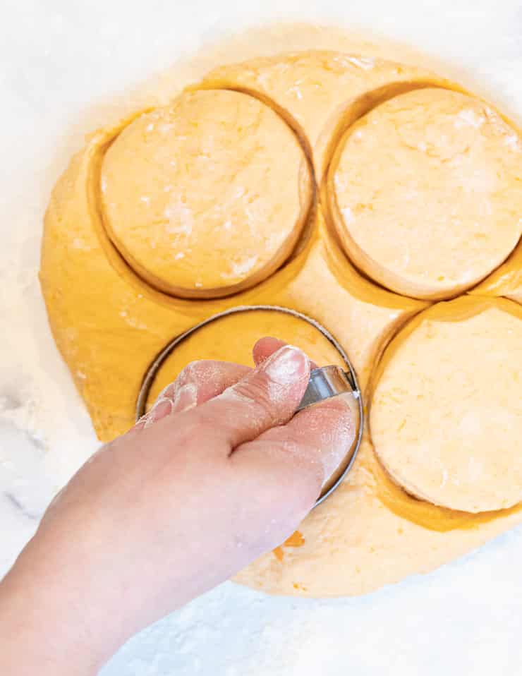 cutting biscuits with a cookie cutter