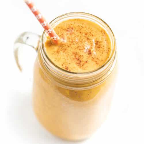 sweet potato smoothie with an orange flowery straw