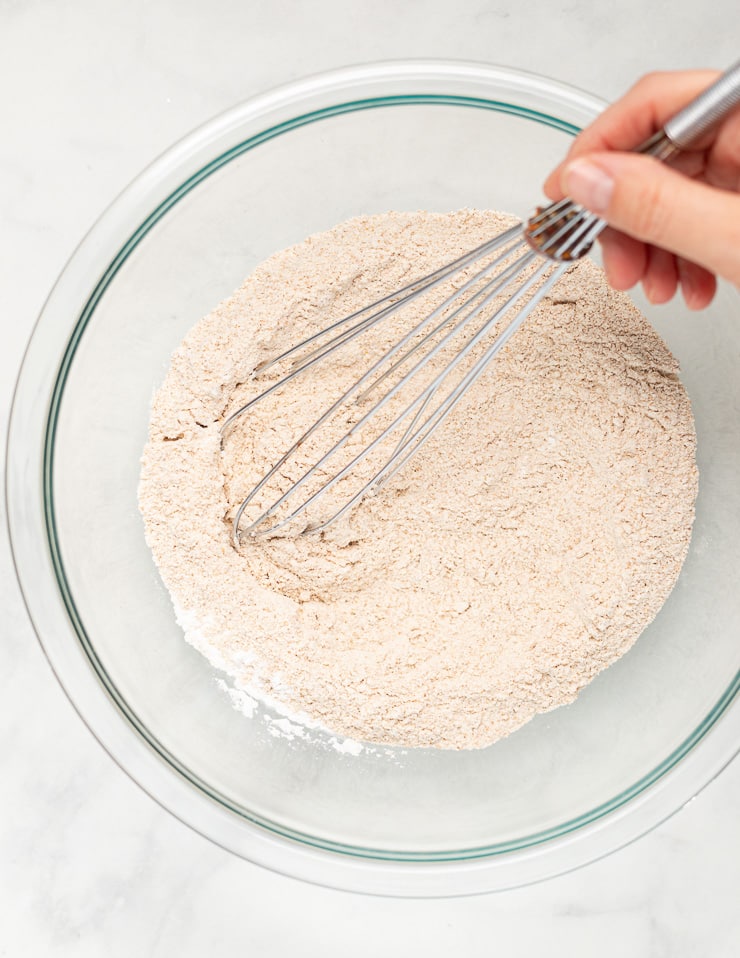 a bowl of dry ingredients for making vegan spelt pancakes 