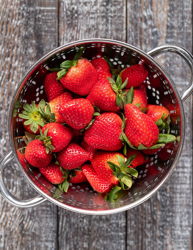 strawberries in a colander