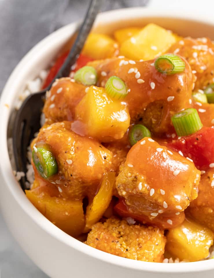 close up shot of saucy tofu in a bowl