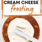 vegan cream cheese frosting on a cake layer