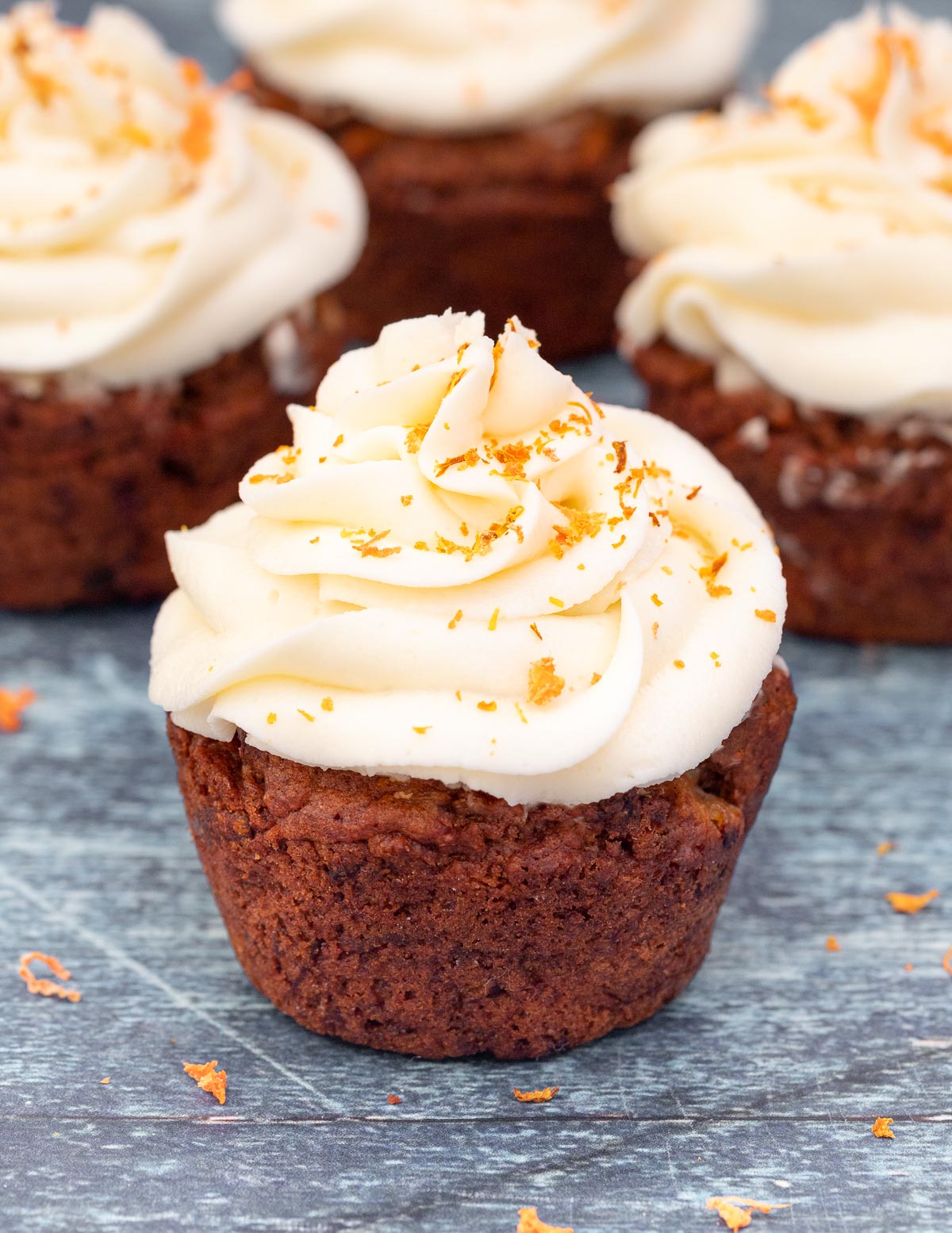 a cupcake with piped vegan cream cheese frosting