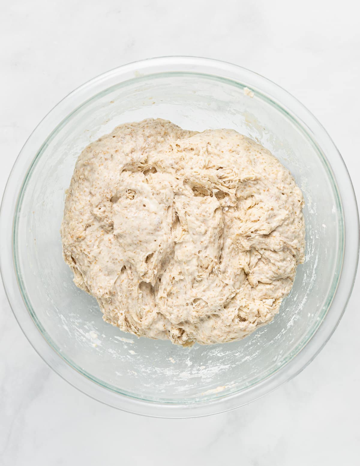 roughly mixed bread dough in a bowl