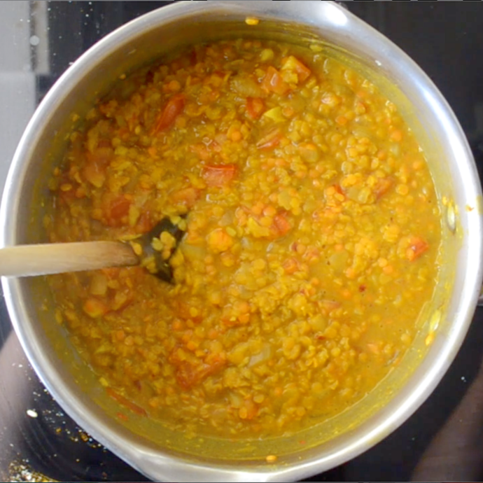 cooked red lentil dahl in a pan