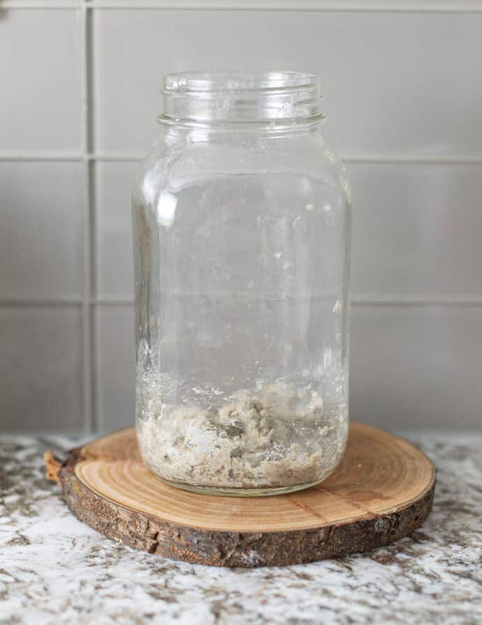 flour and water mixed together in the bottom of a jar