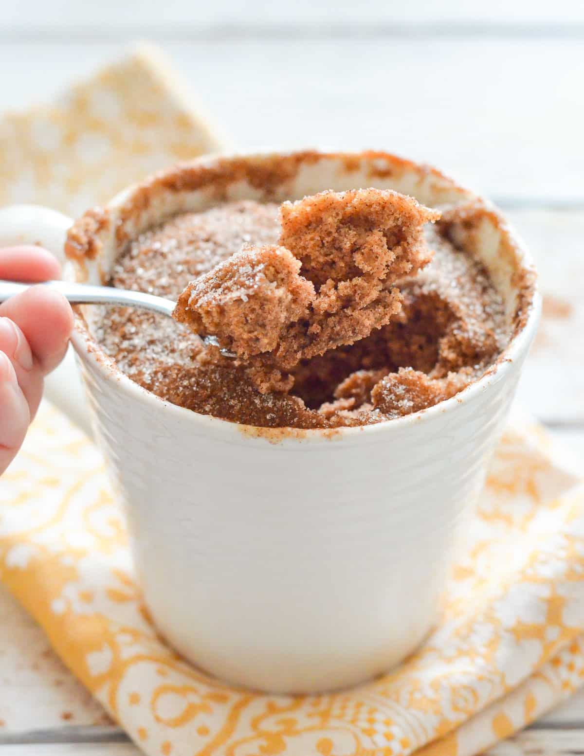 a scoop of mug cake on a spoon