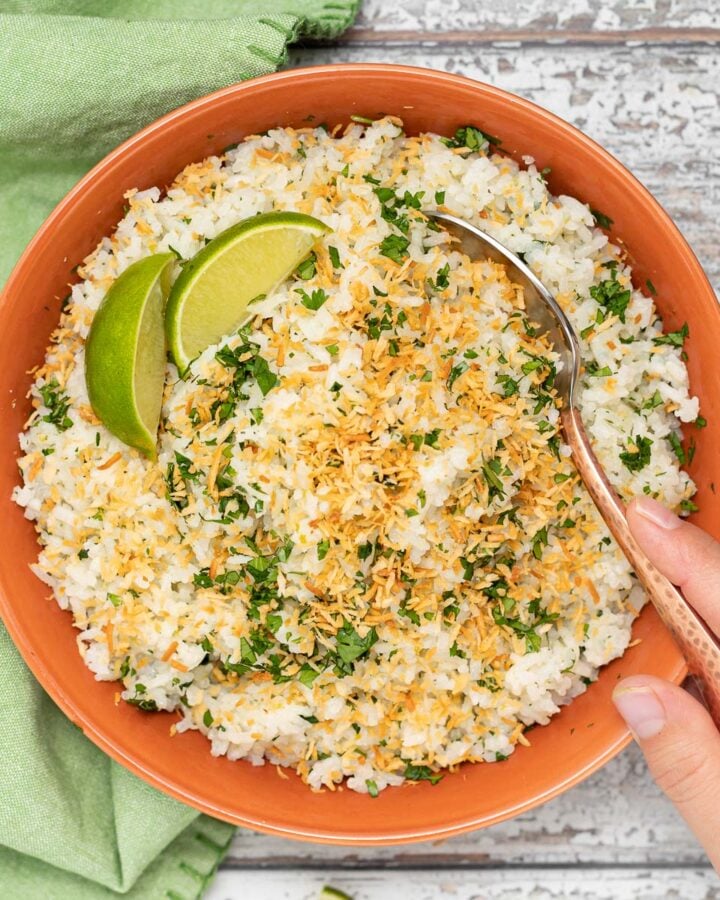 coconut lime rice in a bowl with a spoon