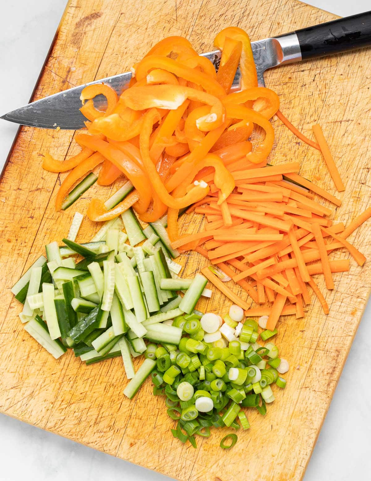 chopped vegetables on a wooden board