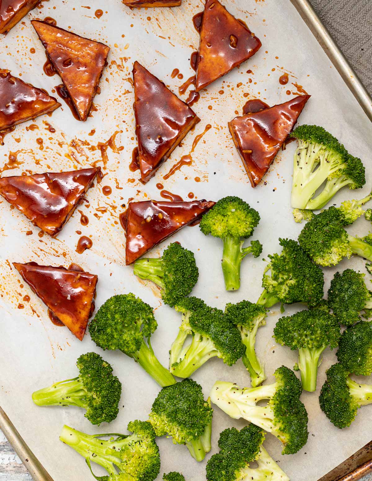 tofu and broccoli on a baking tray