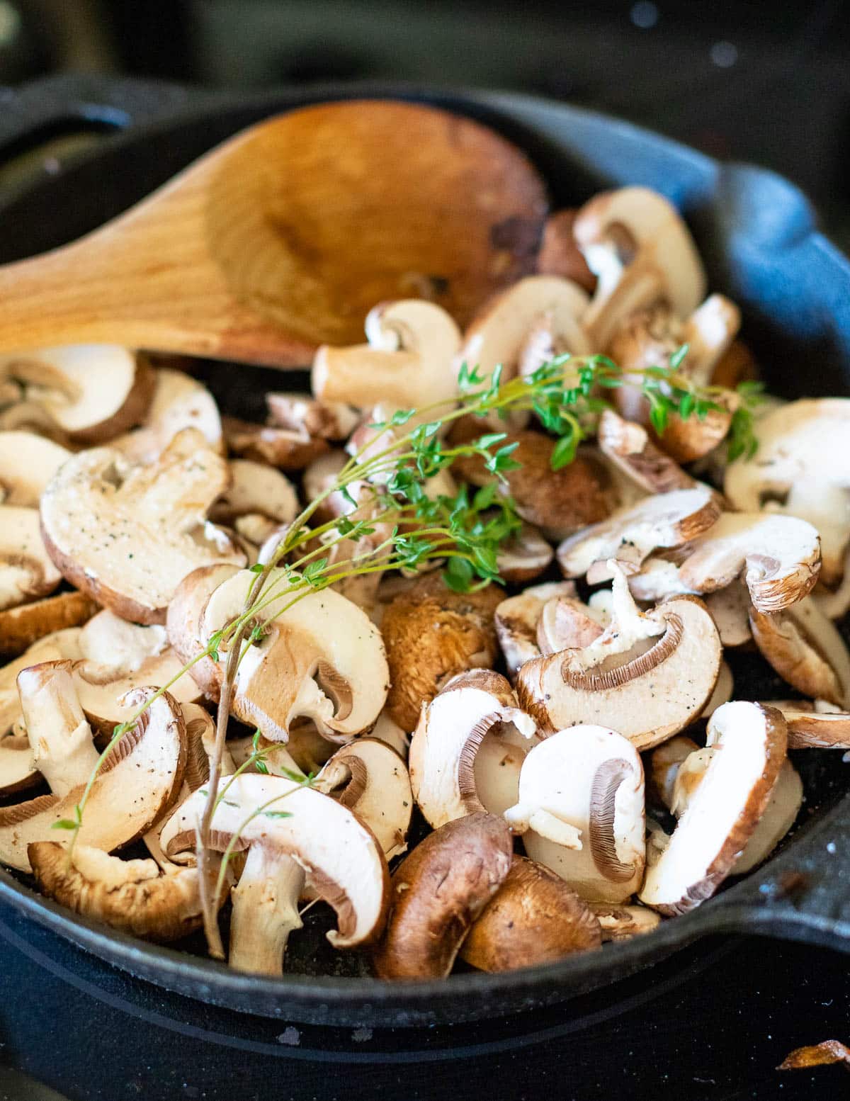mushrooms and thyme in a skillet