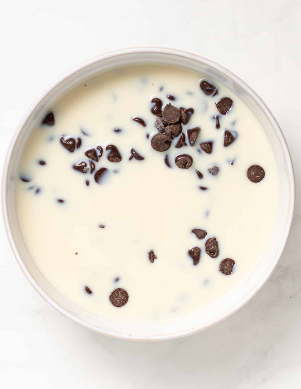 chocolate chips and milk in a bowl