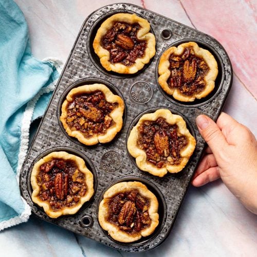 a muffin pan full of vegan butter tarts