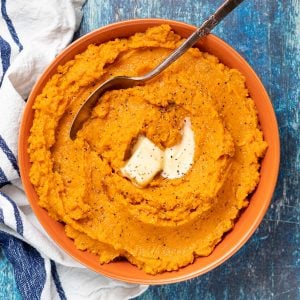 vegan mashed sweet potato in a bowl with vegan butter