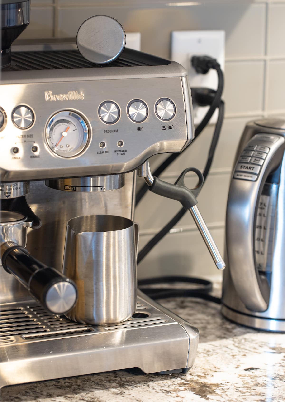 A Breville espresso maker and a kettle 