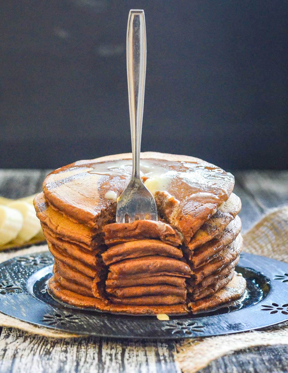 a stack of pancakes with a fork in it