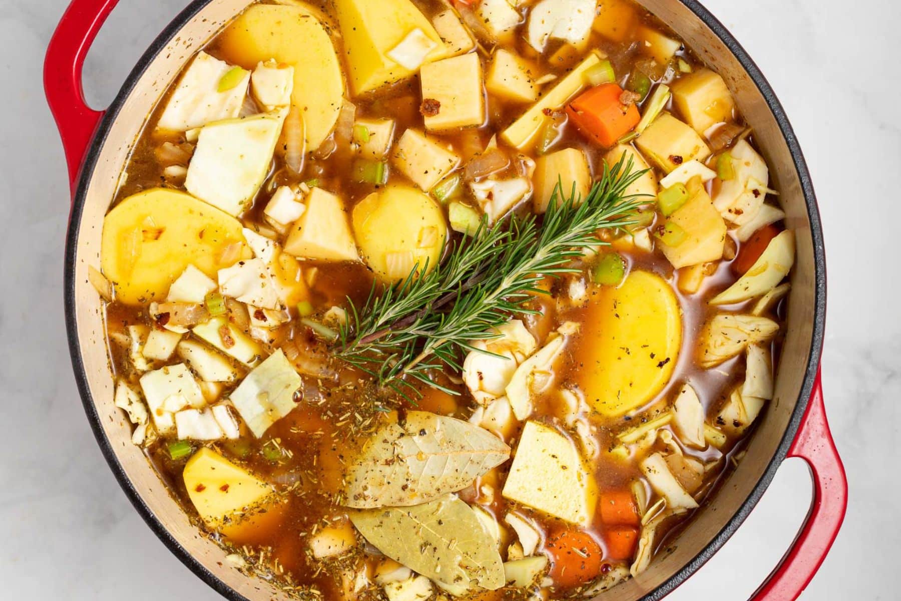 uncooked stew in a Dutch oven