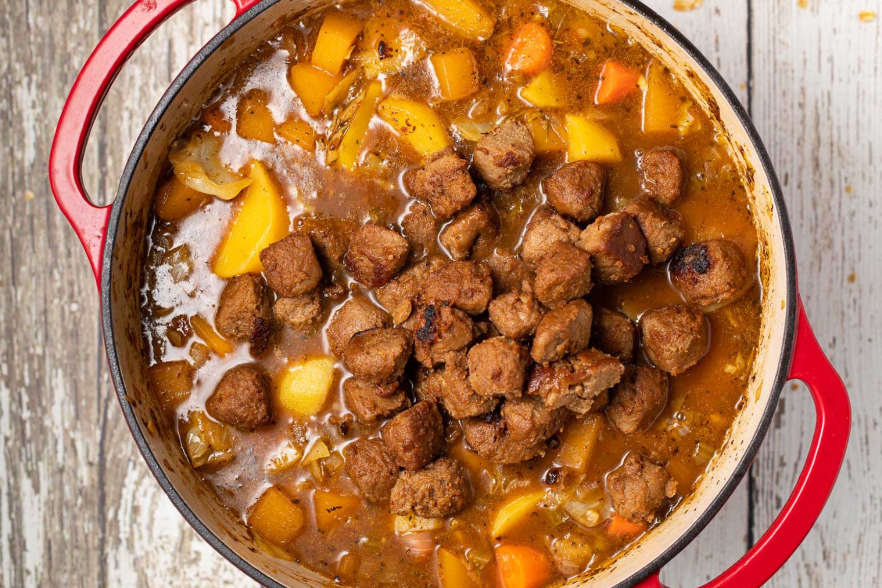 stew with vegan beef chunks in a pan