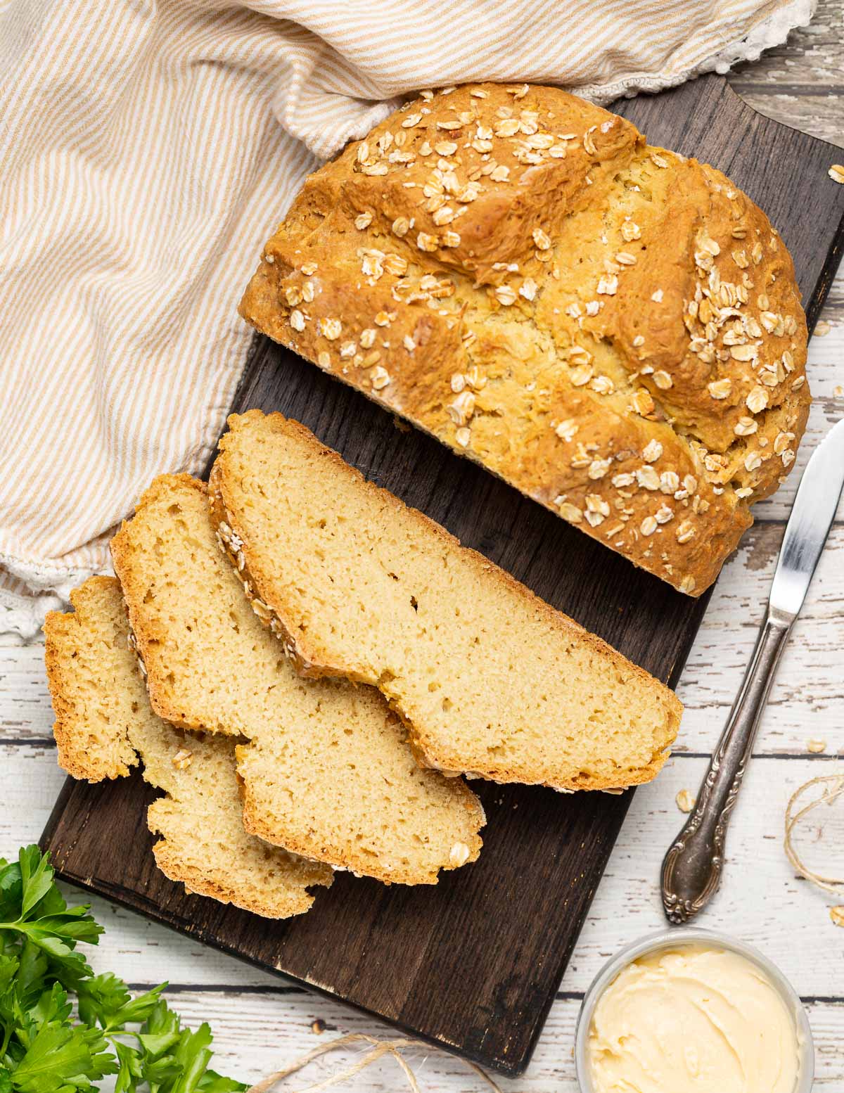 a partially sliced loaf of soda bread