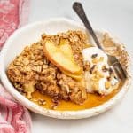 a slice of apple baked oatmeal with yogurt and maple syrup