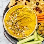 a bowl of curry hummus
