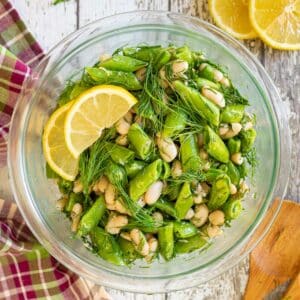 sugar snap pea salad with lemon slice garnish