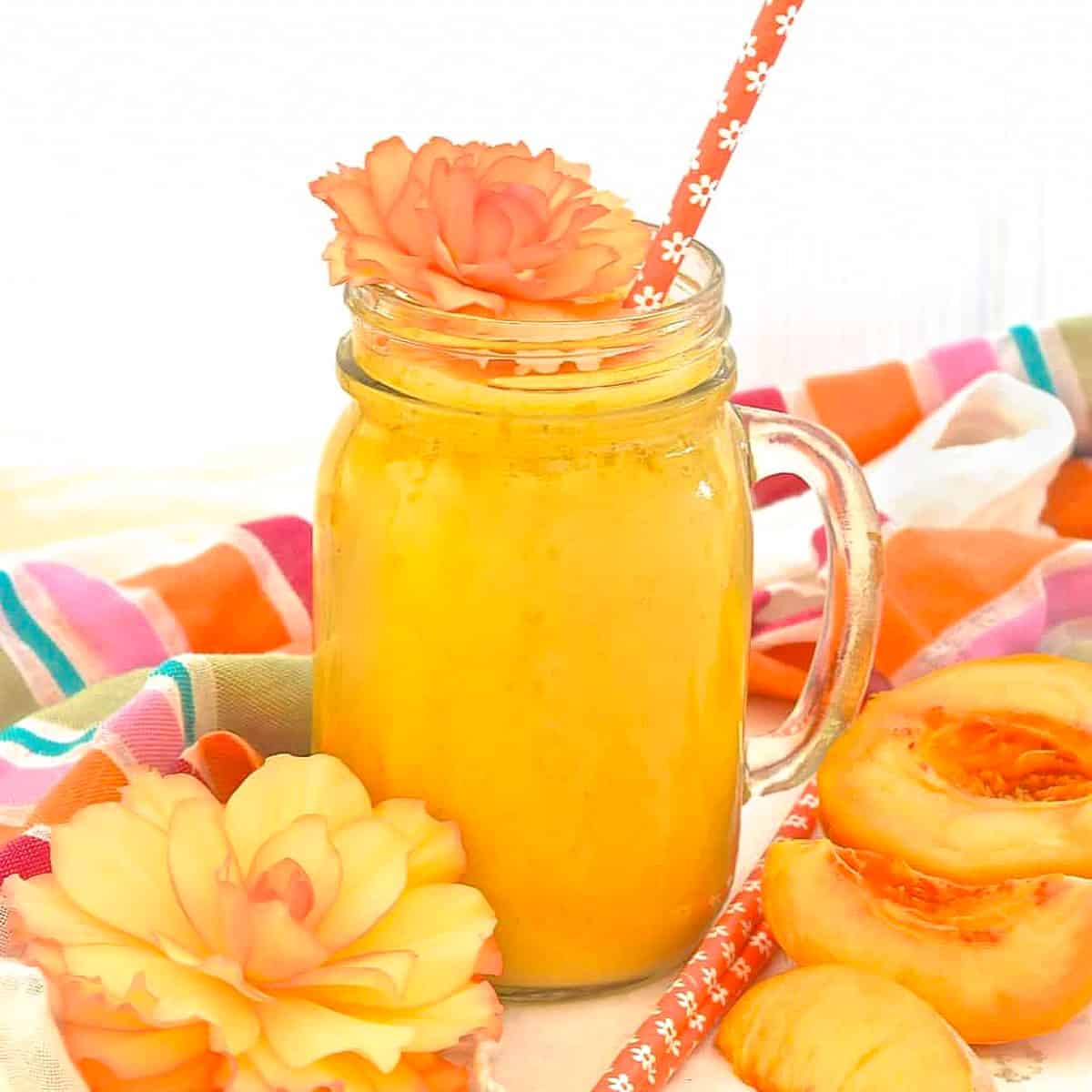 peach smoothie with orange flowers for decoration