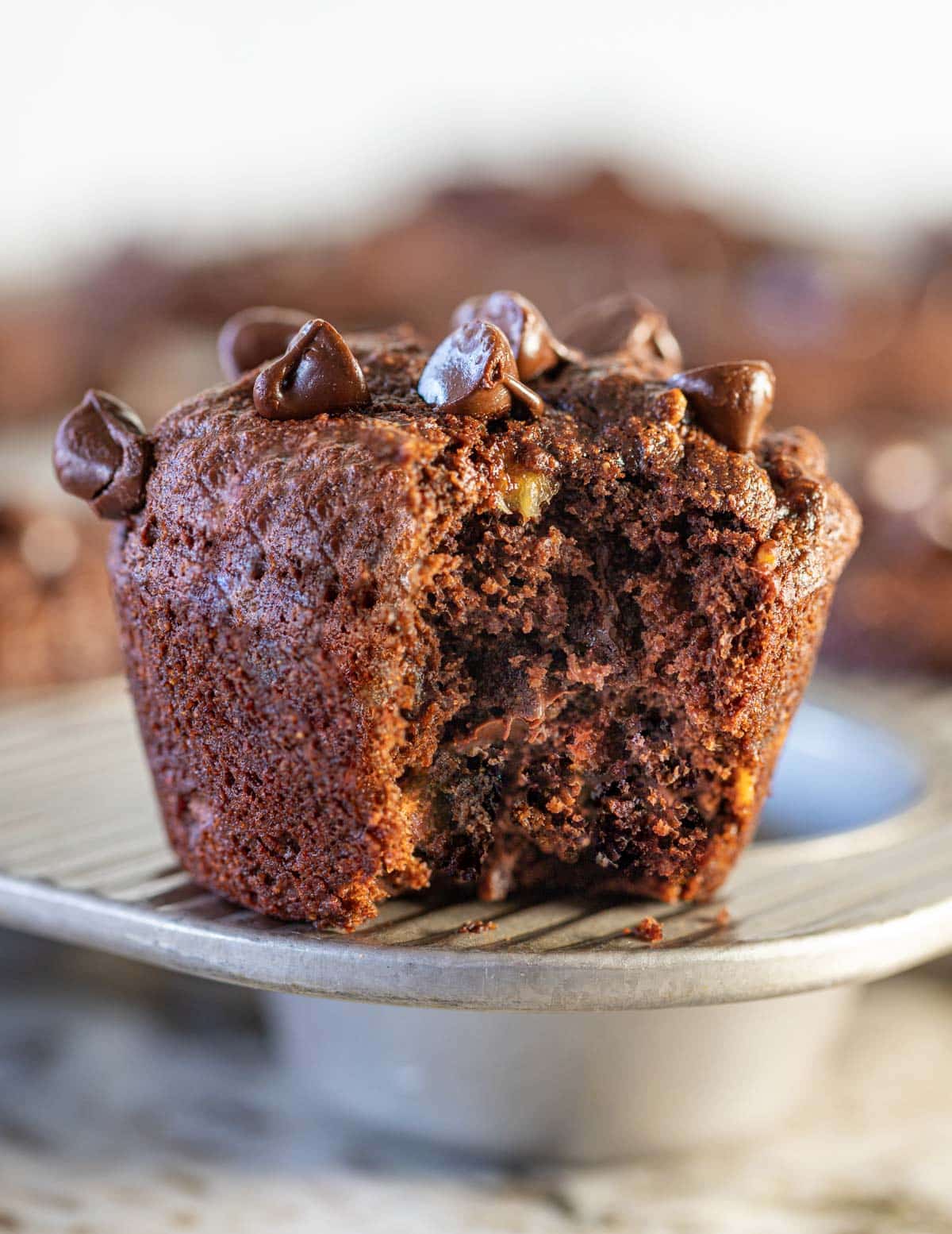 a chocolate banana muffin with a bite taken out