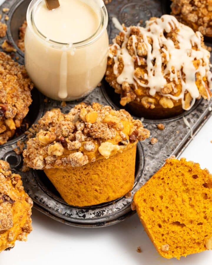 streusel topped pumpkin muffins and a small pot of maple glaze