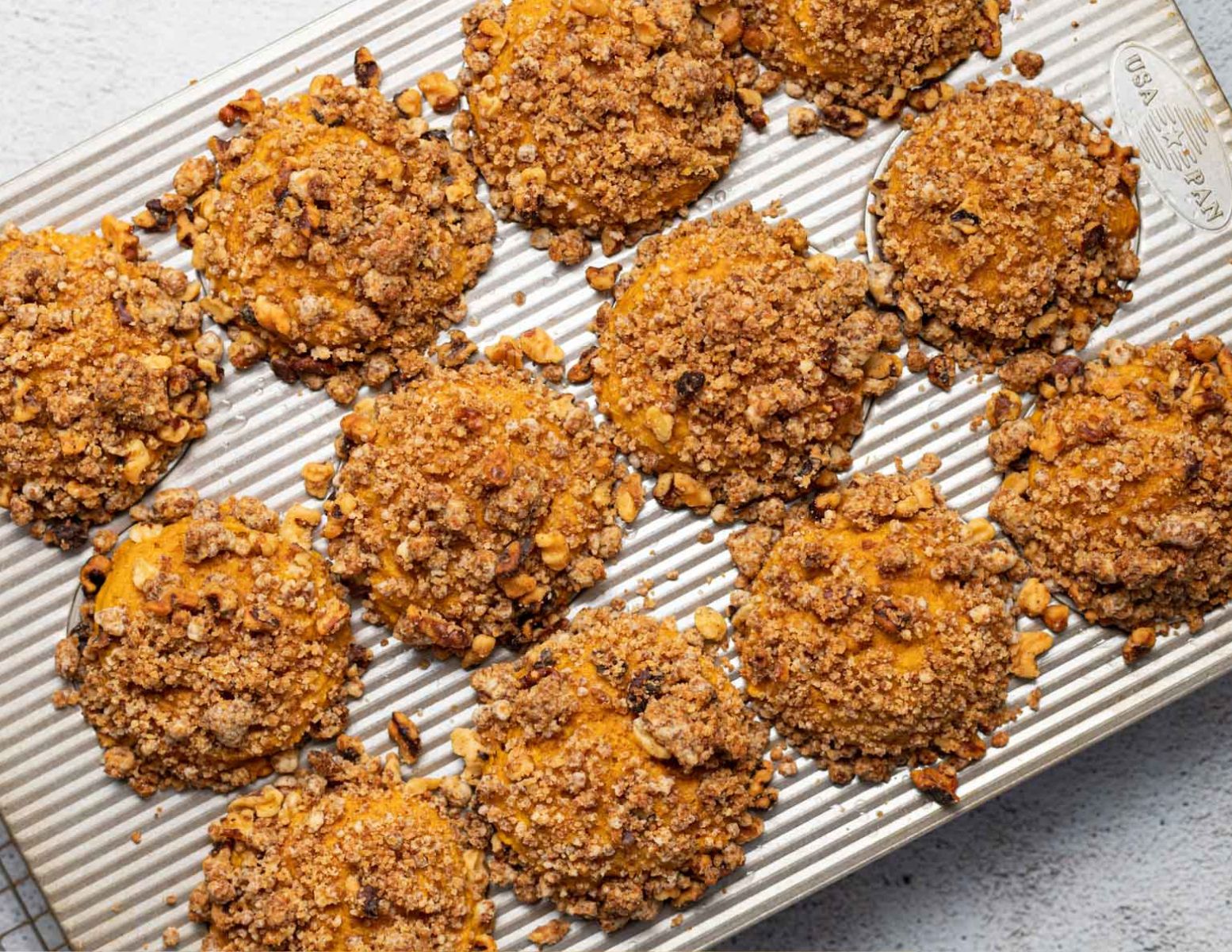 streusel topped muffins in a pan