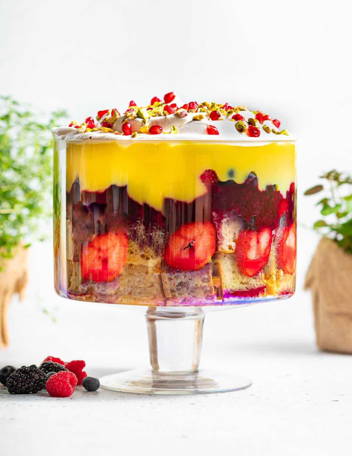 a large vegan trifle in a glass trifle bowl