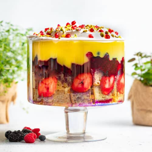 a vegan trifle in a large glass trifle bowl