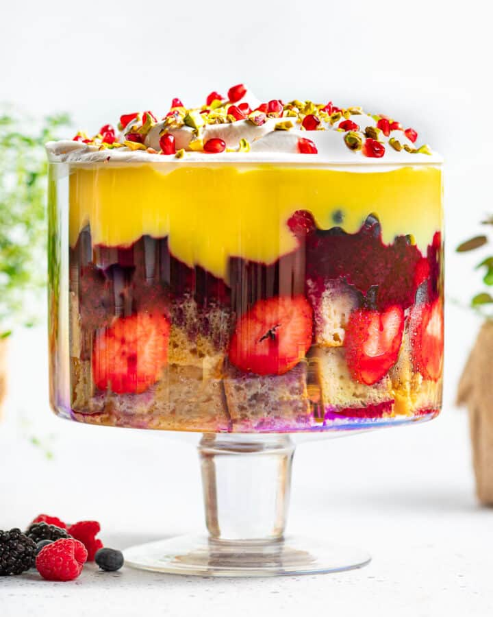 a vegan trifle in a large glass trifle bowl