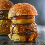 A Vegan BBQ burger in a bun with BBQ sauce