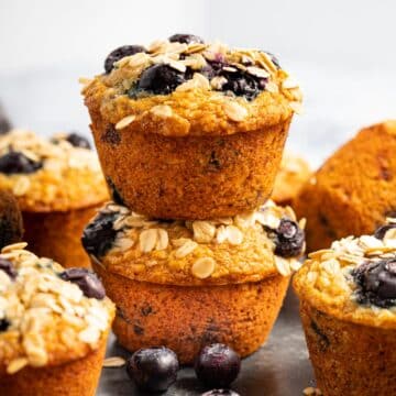 2 banana oatmeal blueberry muffins stacked on top of each other