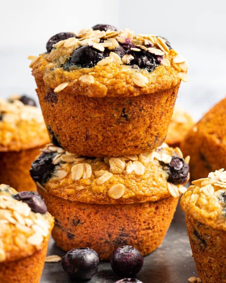 2 banana oatmeal blueberry muffins stacked on top of each other