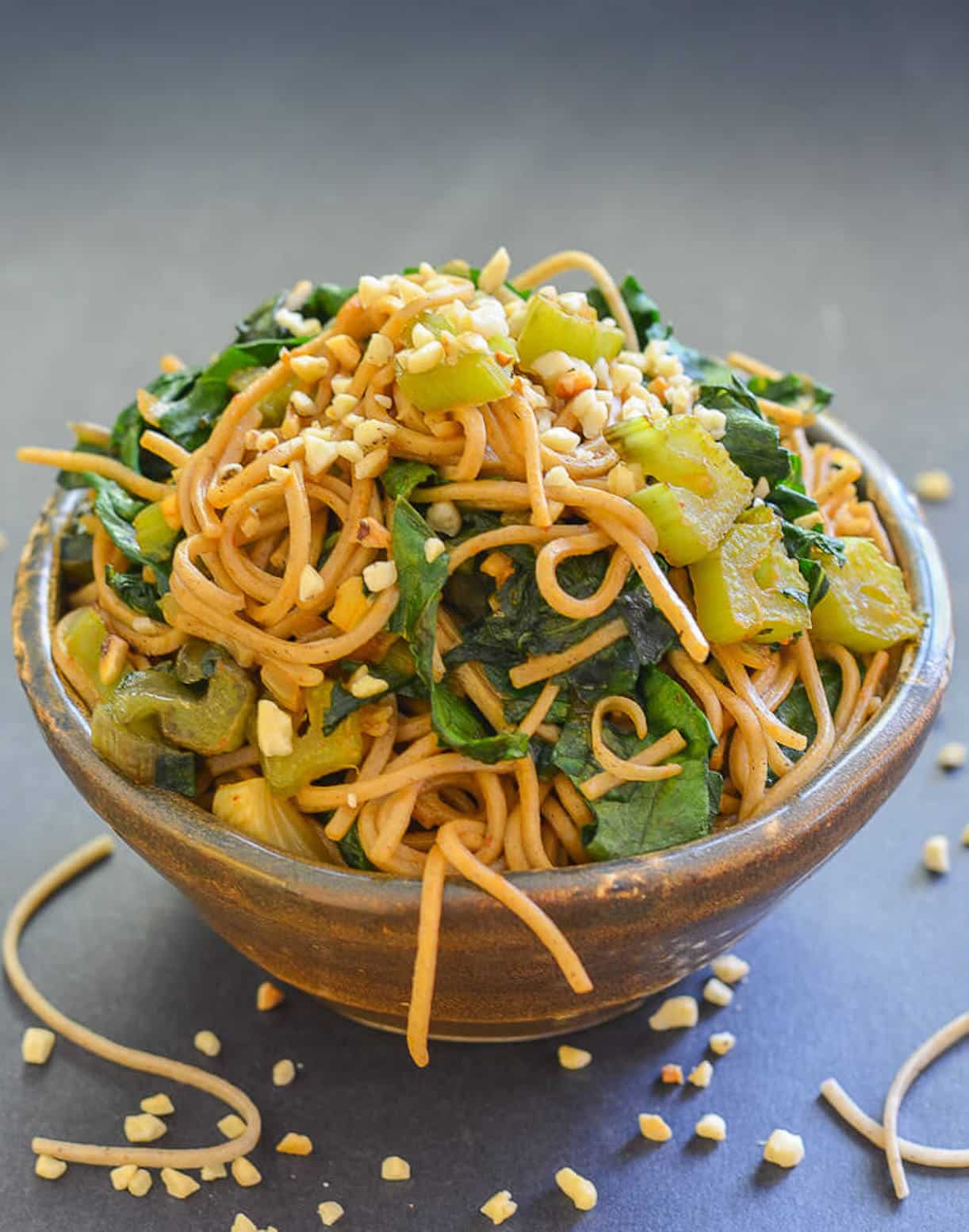 a bowl of swiss chard and noodle stir fry 