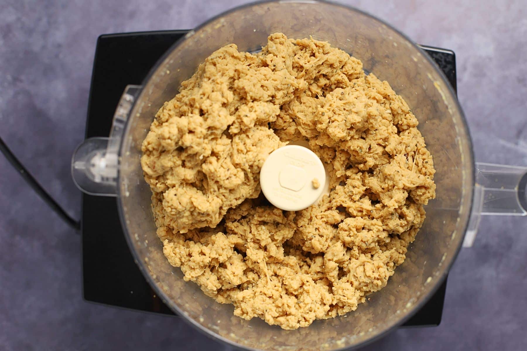 partially blended vegan seitan chicken dough in a food processor