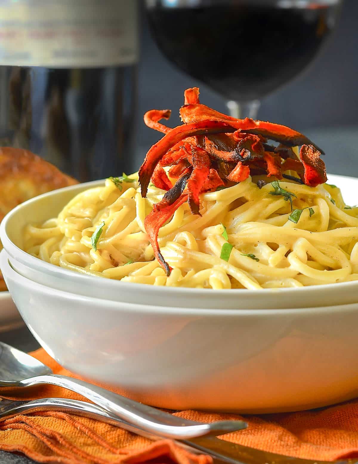 a bowl of vegan carbonara with smoky carrot rashers