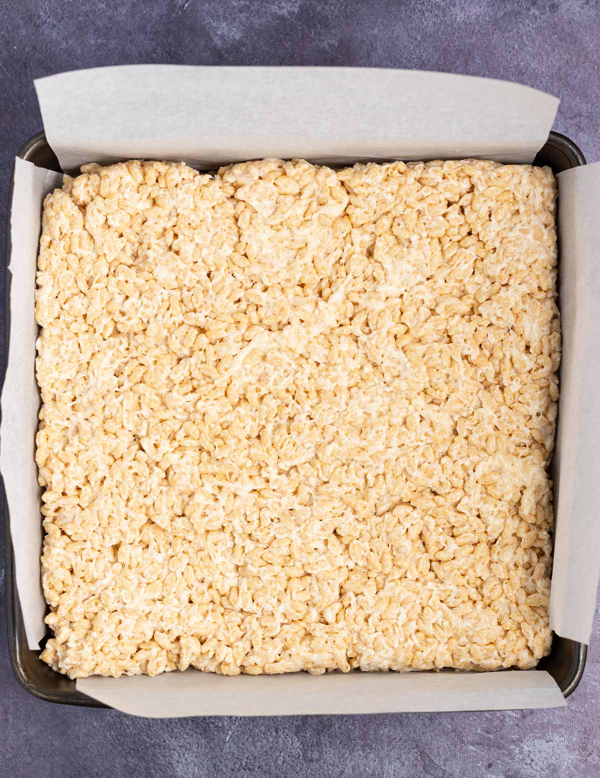 a pan of uncut rice crispy treats