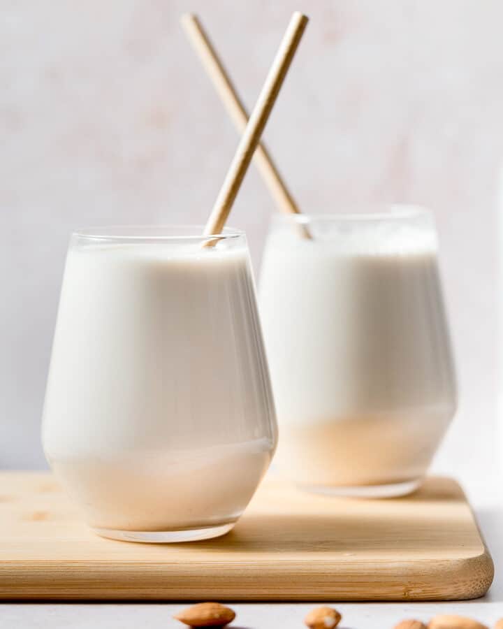 2 glasses of almond milk with straws