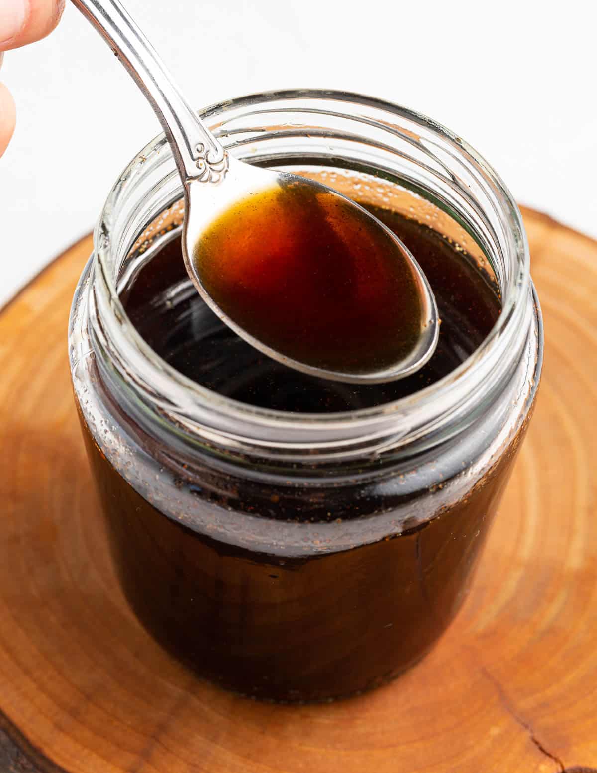 a spoonful of brown sugar syrup over a jar