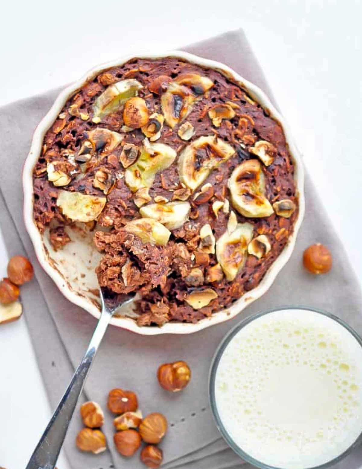 a dish of chocolate banana hazelnut oatmeal