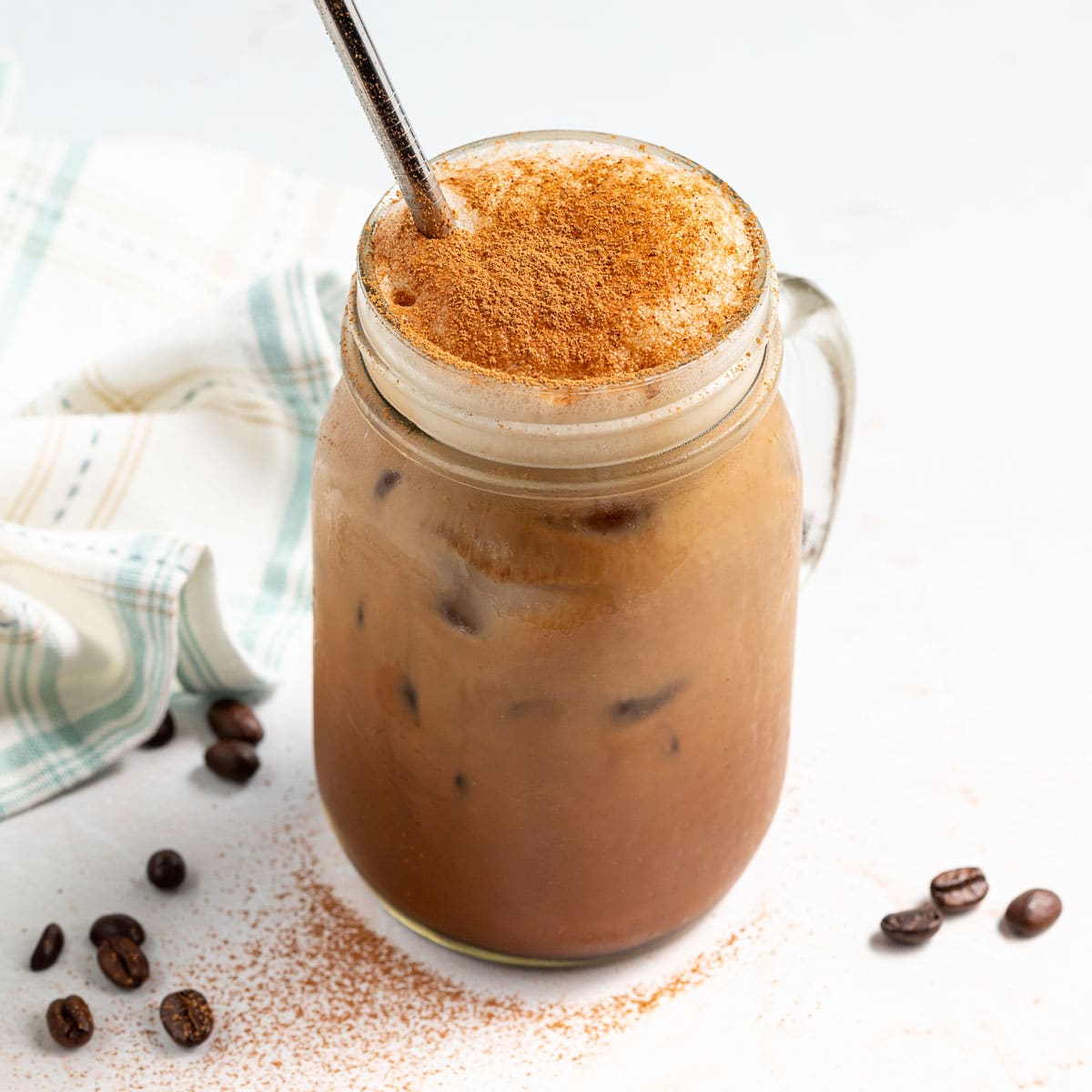 a glass of iced chocolate almond milk shaken espresso