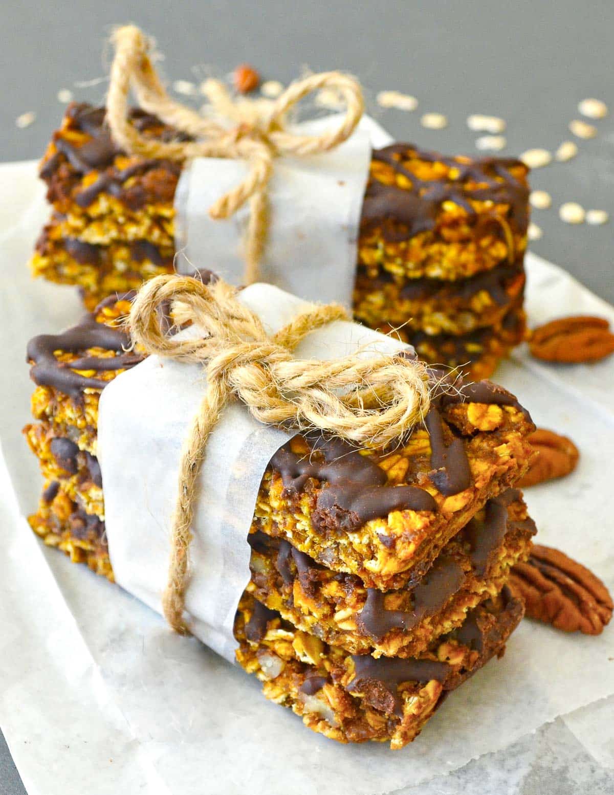 a stack of pumpkin granola bars tied with string 