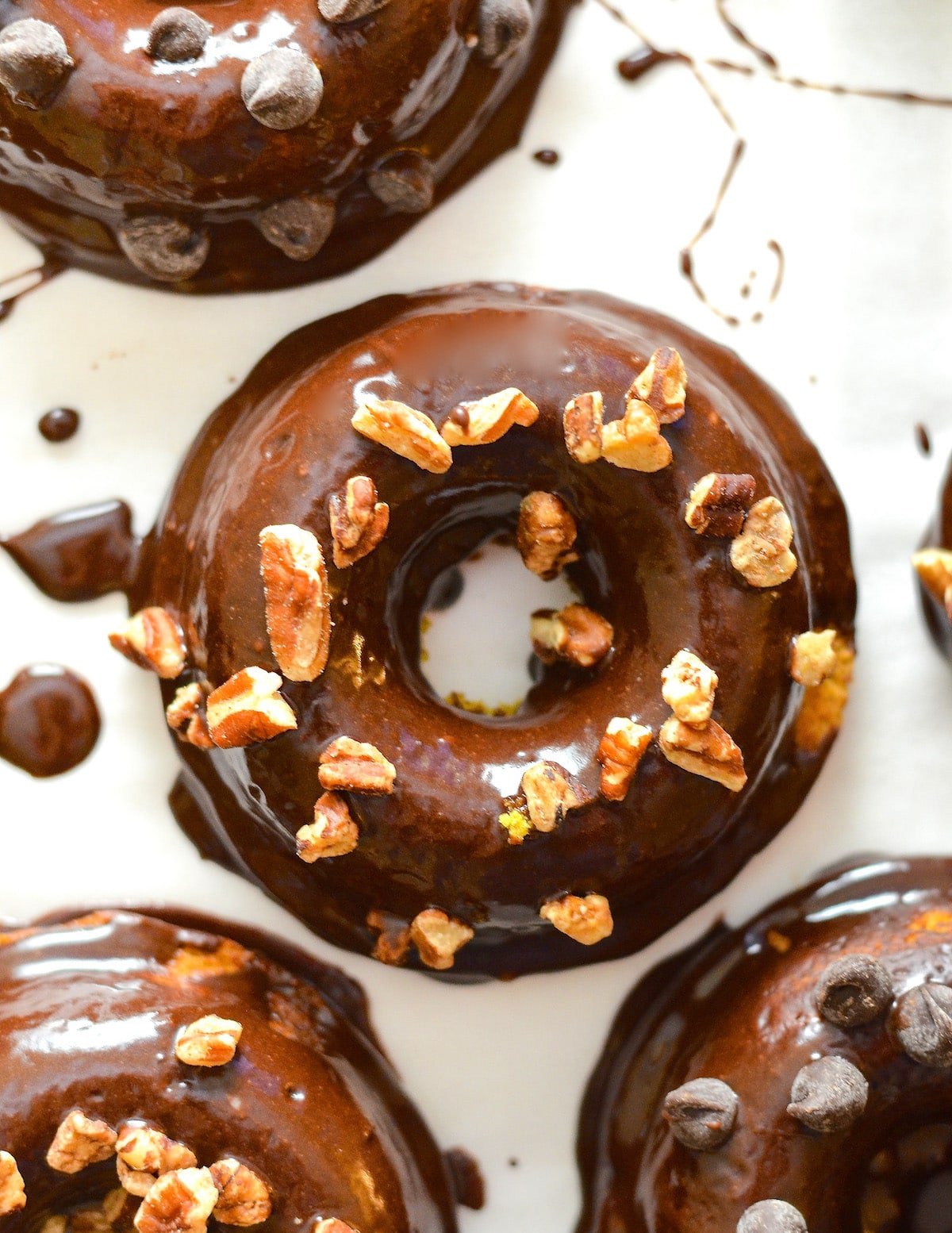 Chocolate Pumpkin Donuts with pecan nut sprinkles taken from above 