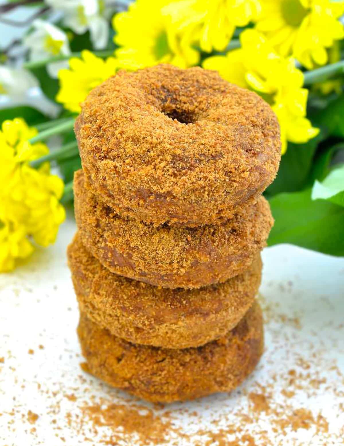 a stack of vegan pumpkin donuts