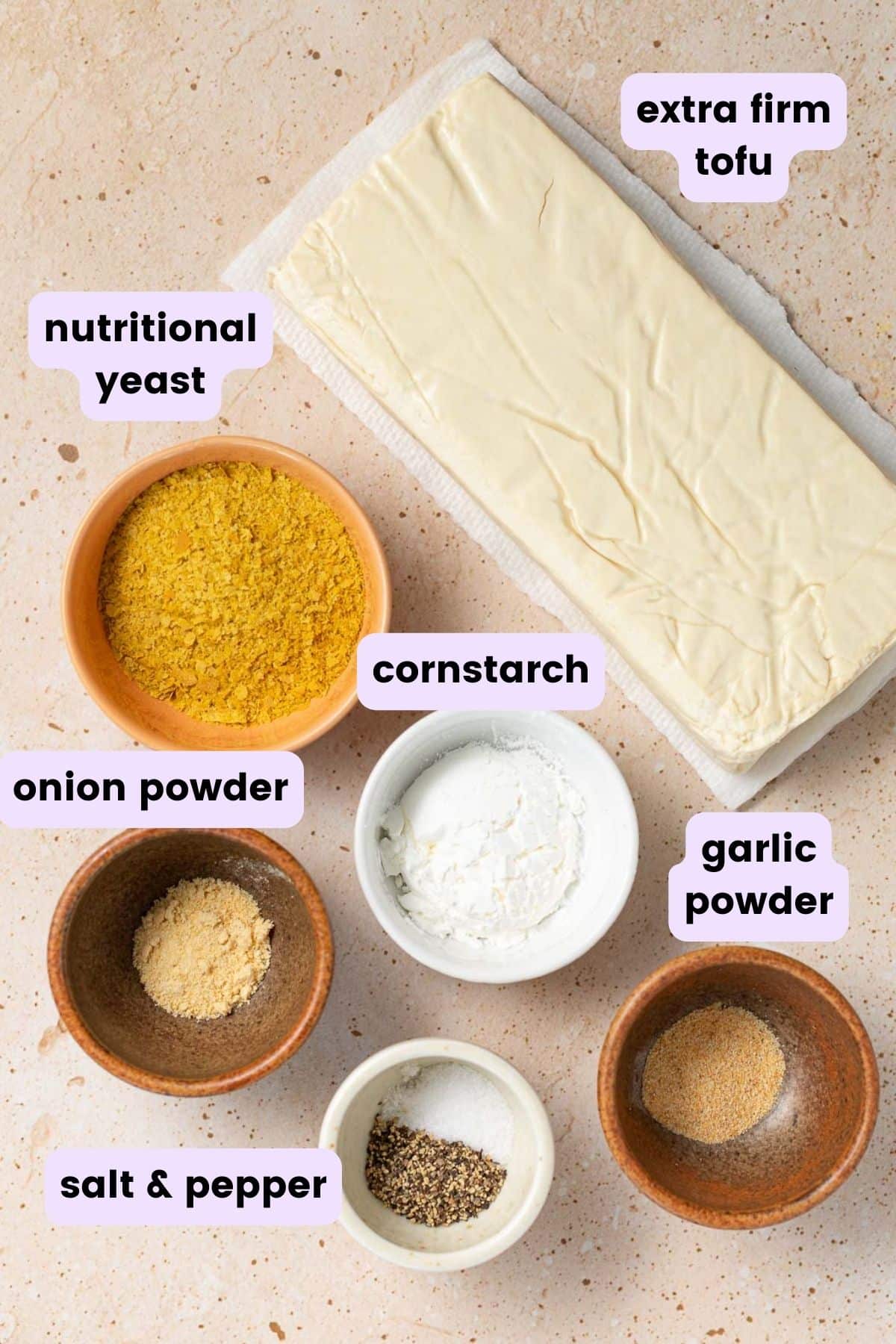 ingredients needed for this recipe: tofu, nutritional yeast, onion & garlic powder, salt & pepper, cornstarch. 
